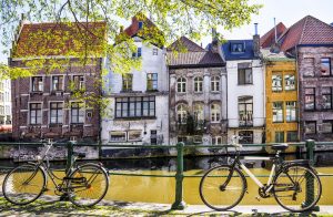 old medieval houses in ghent at sunny spring evening, belgium. visit on a springtime river cruise