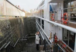 River Ship Moored next to wall in Cologne. Problems with river cruising