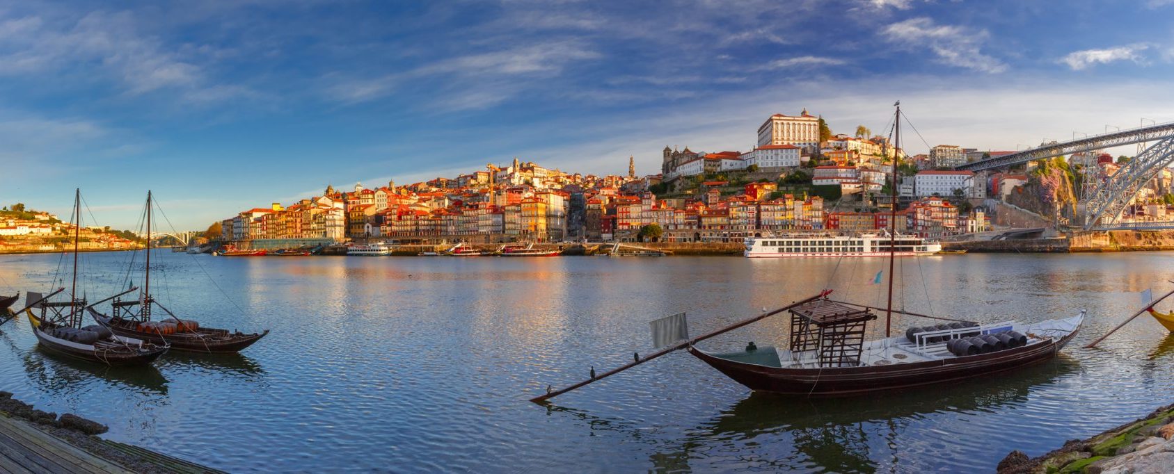 Douro - Panoramic-view-of-traditional-rabelo-boats-with-barrels-of-Port-wine-on-the-Douro-riverLowRes